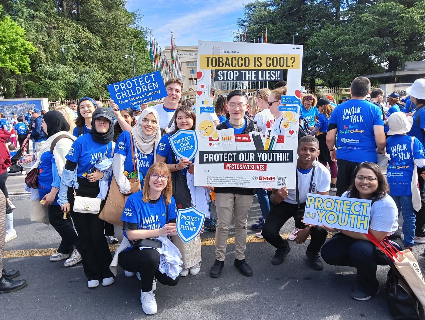 Young advocates in Walk the Talk T-shirts holding “Protect children from tobacco industry interference”, “Protect our future” and “Protect the youth” placards outside the Palais des Nations